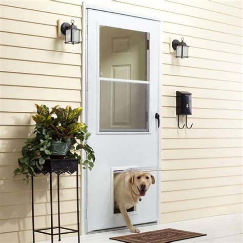 Shift attention away from or draw it to the front door by leaving the storm door closed and the front door open. . Pet door in storm door